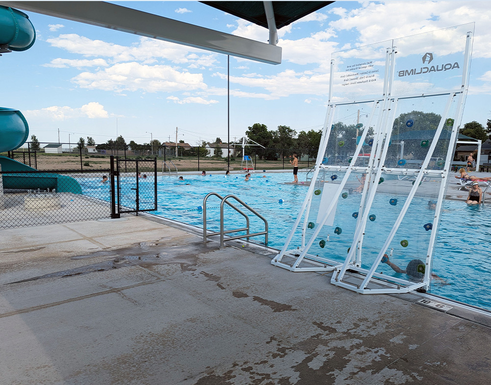 people swimming in julesburg pool